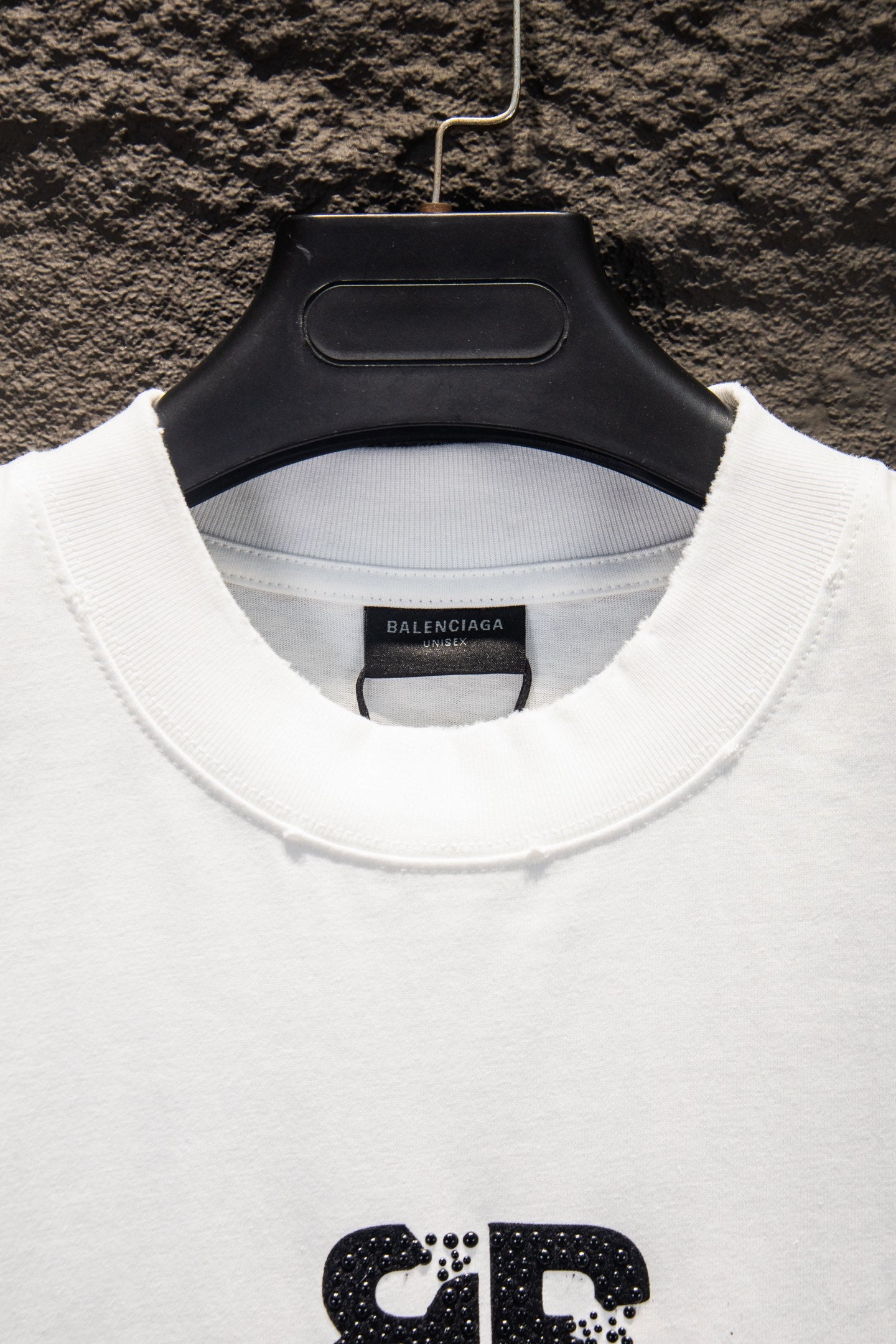 Balenciaga white T-shirt neckline detail with ribbed collar and logo