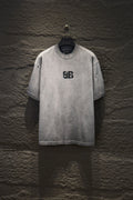 Light gray crewneck T-shirt with black Balenciaga logo on chest
