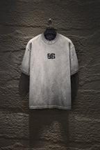 Light gray crewneck T-shirt with black Balenciaga logo on chest