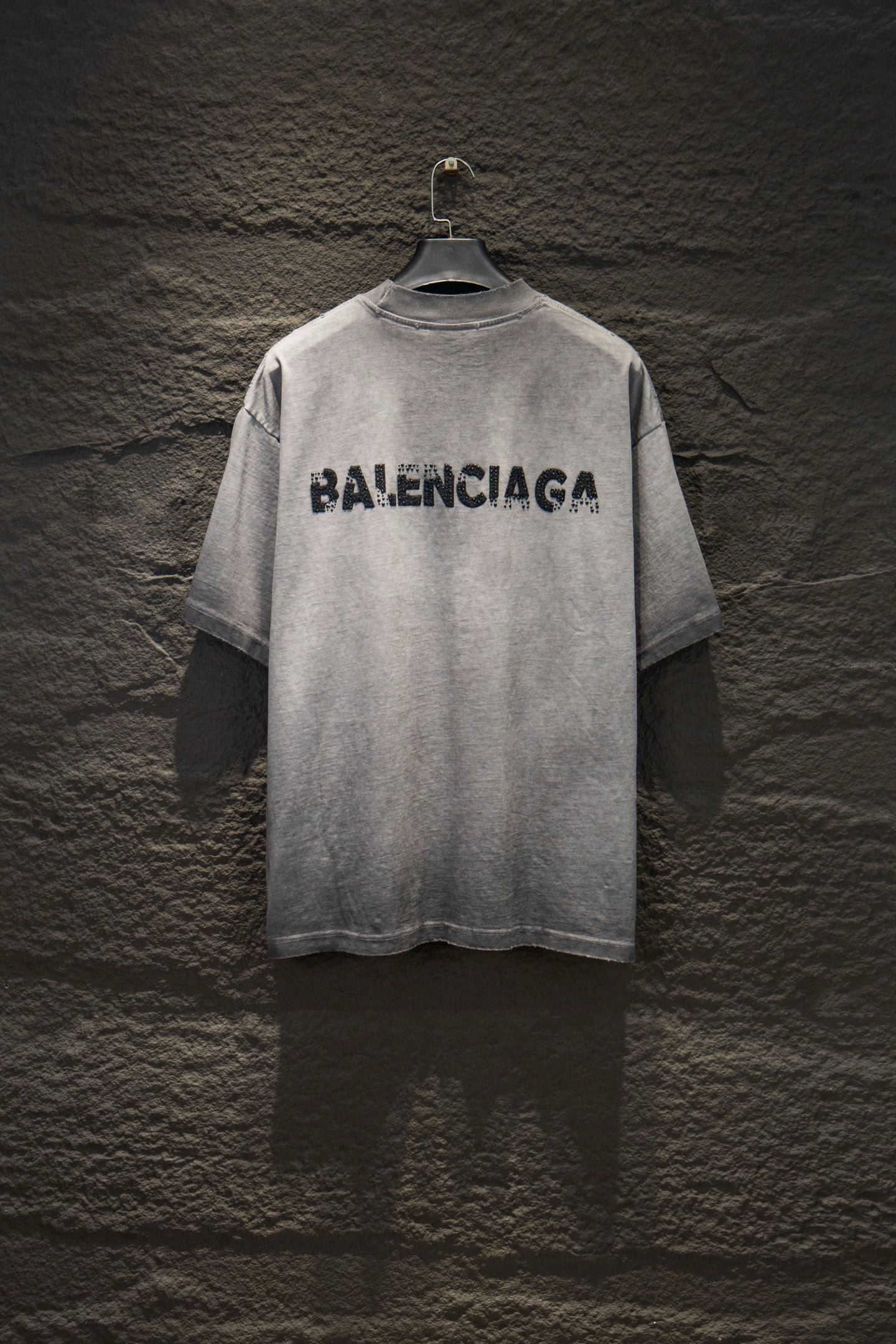 Light gray crewneck T-shirt with black BALENCIAGA logo on back