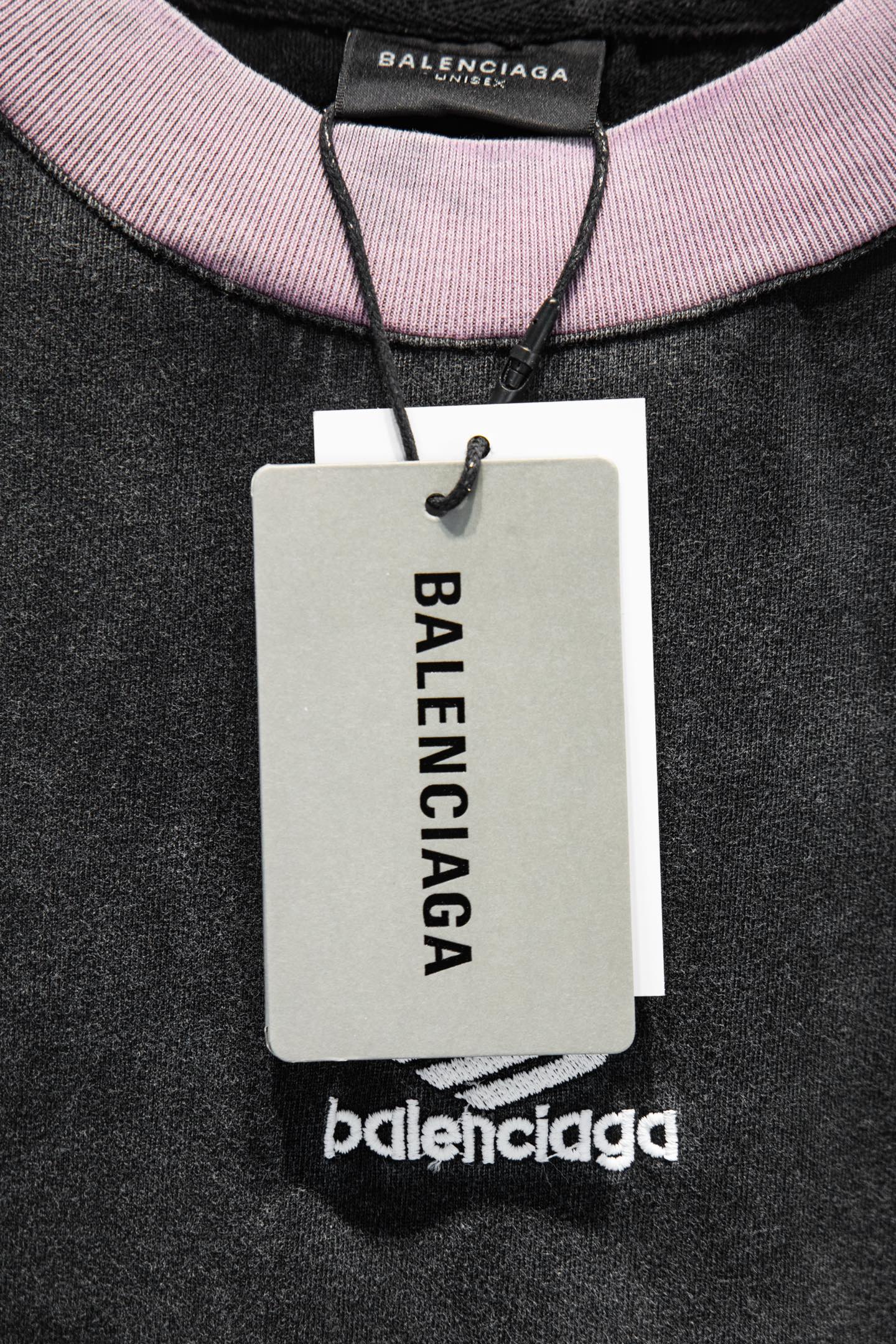 Balenciaga T-shirt with pink ribbed collar and hanging tag; black fabric