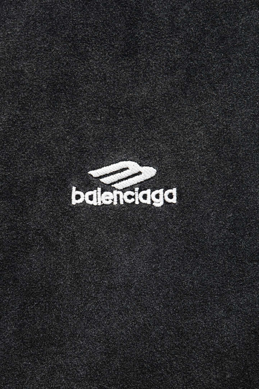 Balenciaga T-shirt logo patch on dark fabric