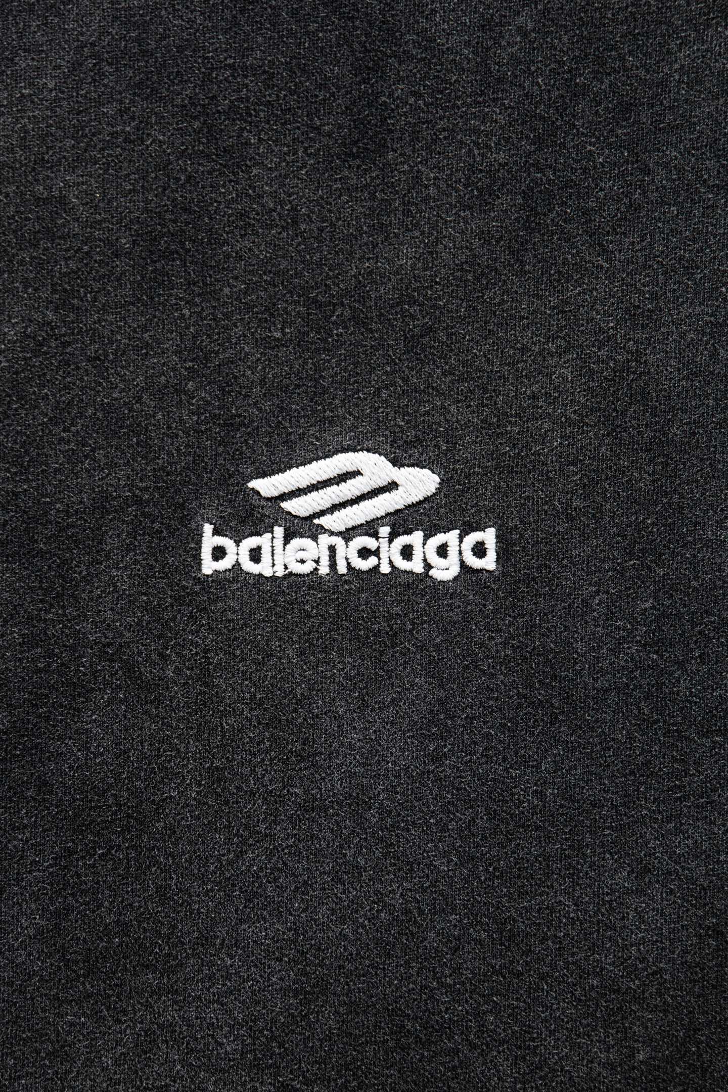Balenciaga T-shirt logo patch on dark fabric