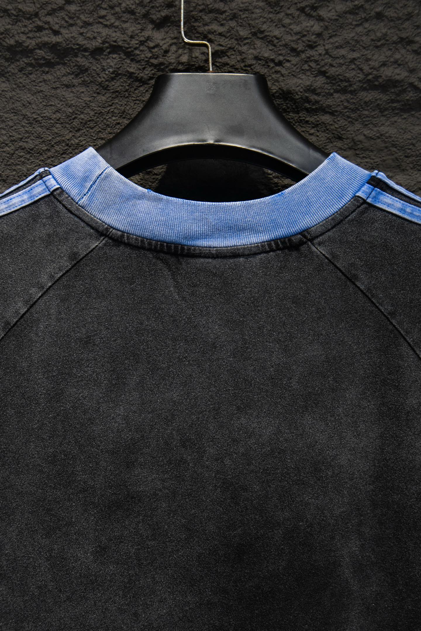 Balenciaga T-shirt neckline close-up with light blue rib trim