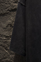 Balenciaga T-shirt side view, dark gray hem and stitched seam