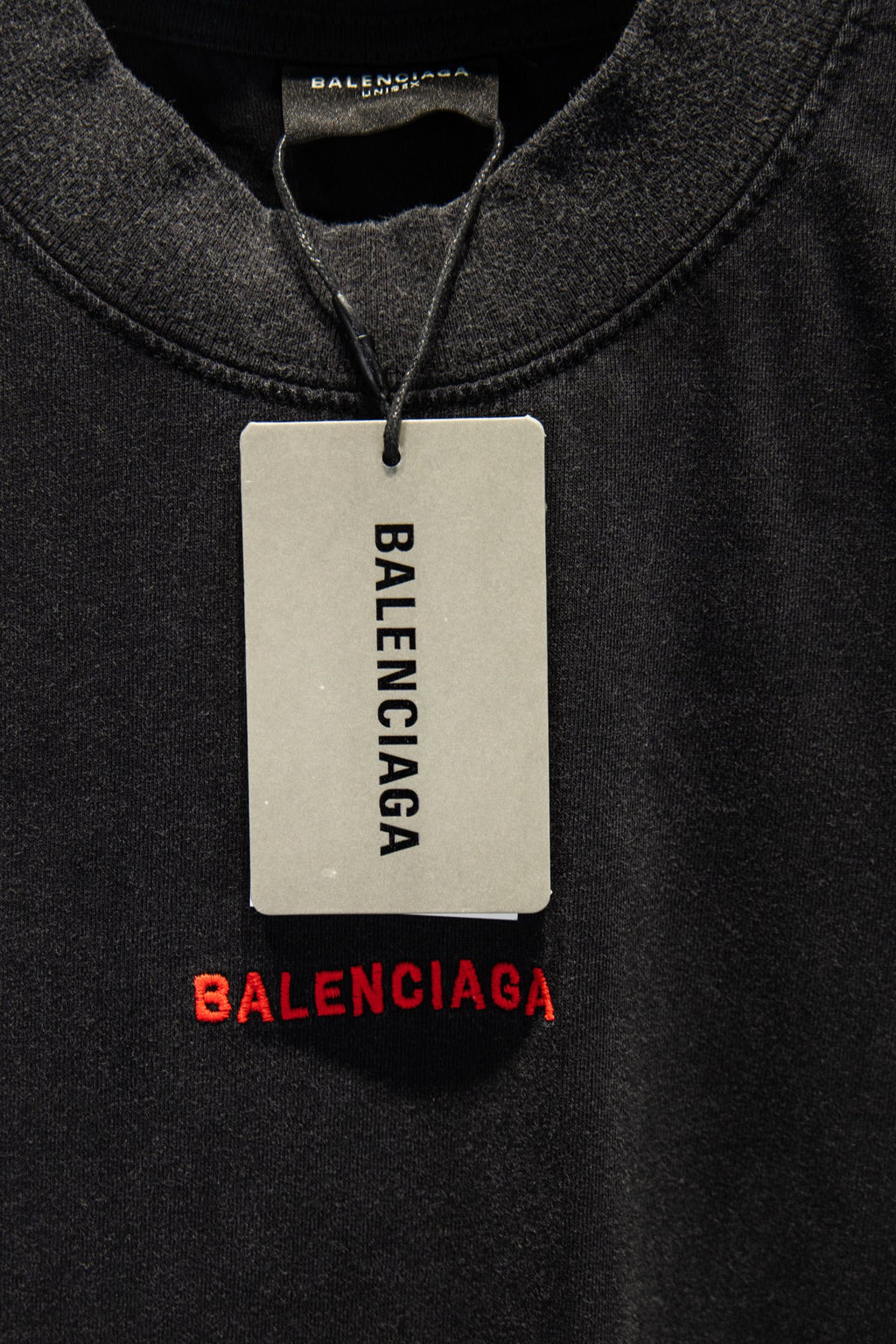 Balenciaga T-shirt with hanging size tag and red BALENCIAGA logo