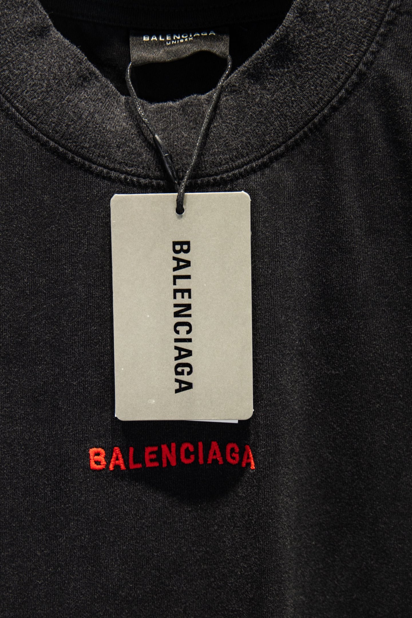 Balenciaga T-shirt with hanging size tag and red BALENCIAGA logo