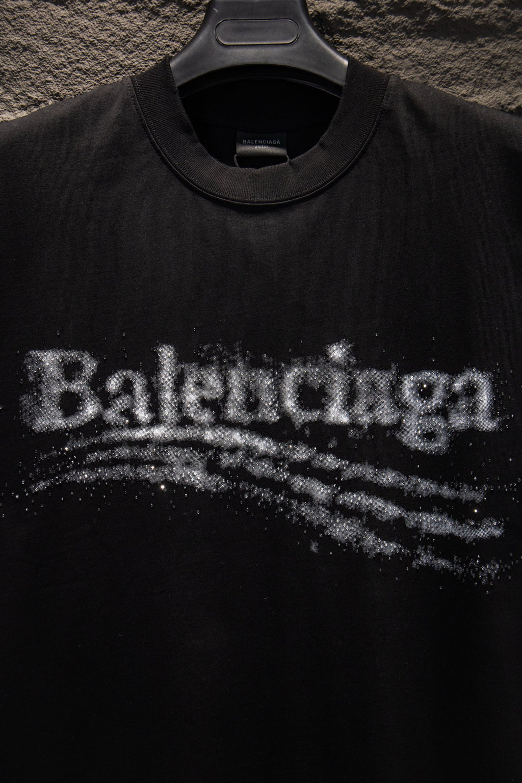 Black T-shirt chest logo detail with distressed Balenciaga lettering