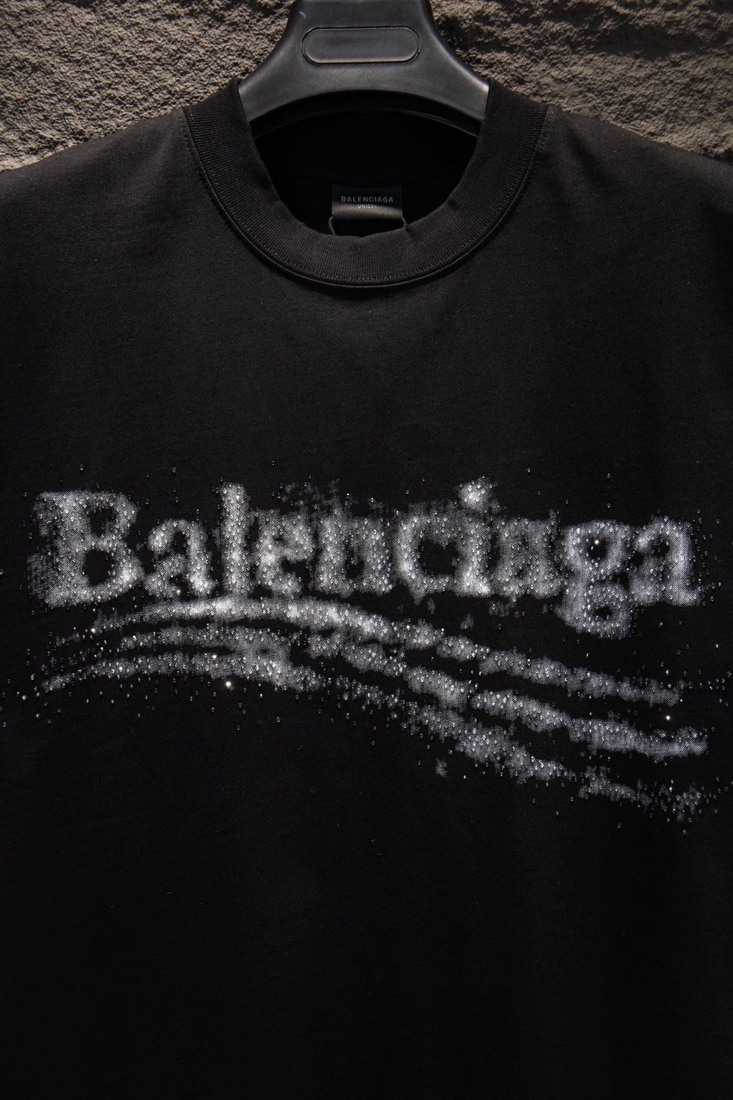 Black T-shirt chest logo detail with distressed Balenciaga lettering
