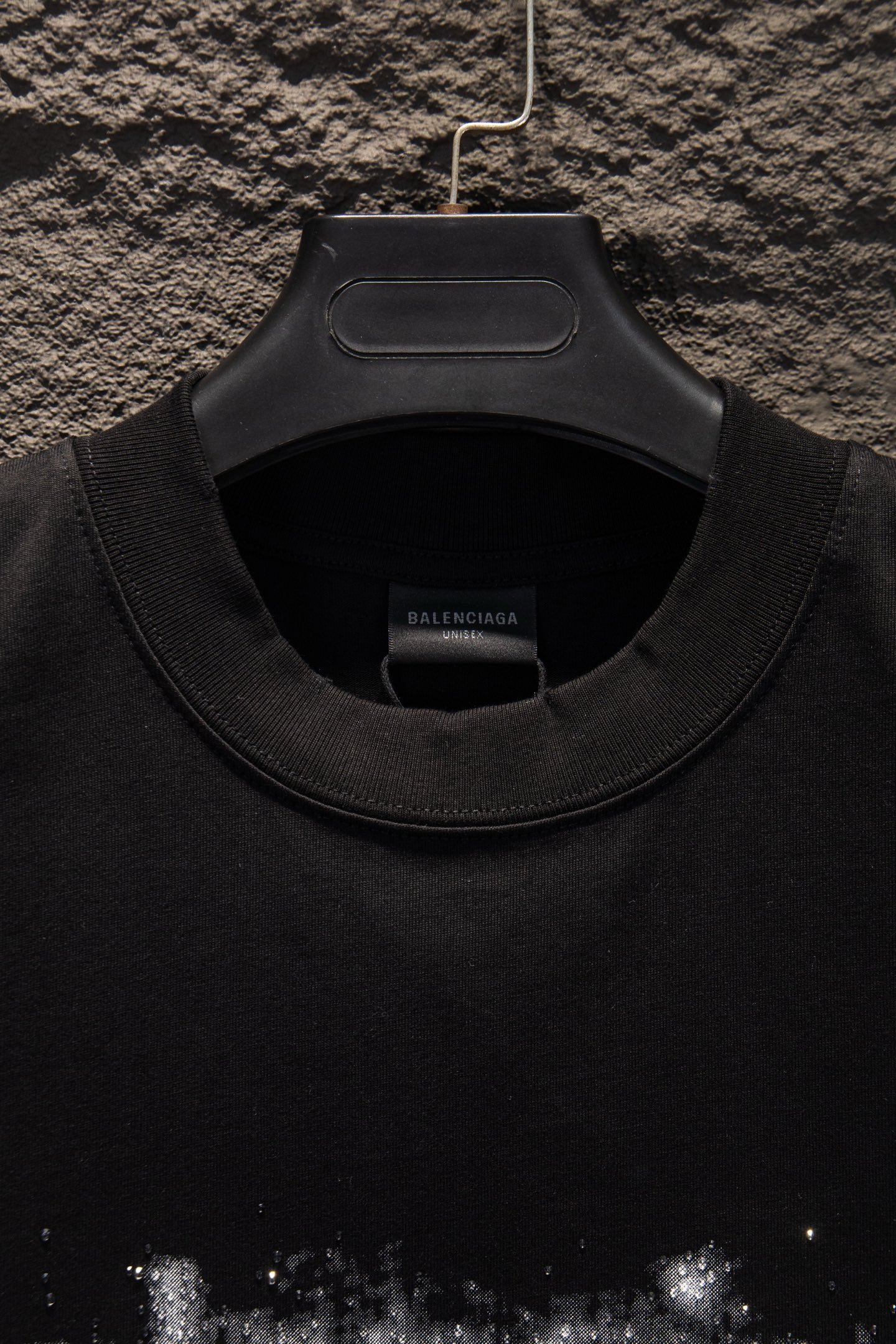 Black T-shirt neckline with ribbed crew collar and inner neck label