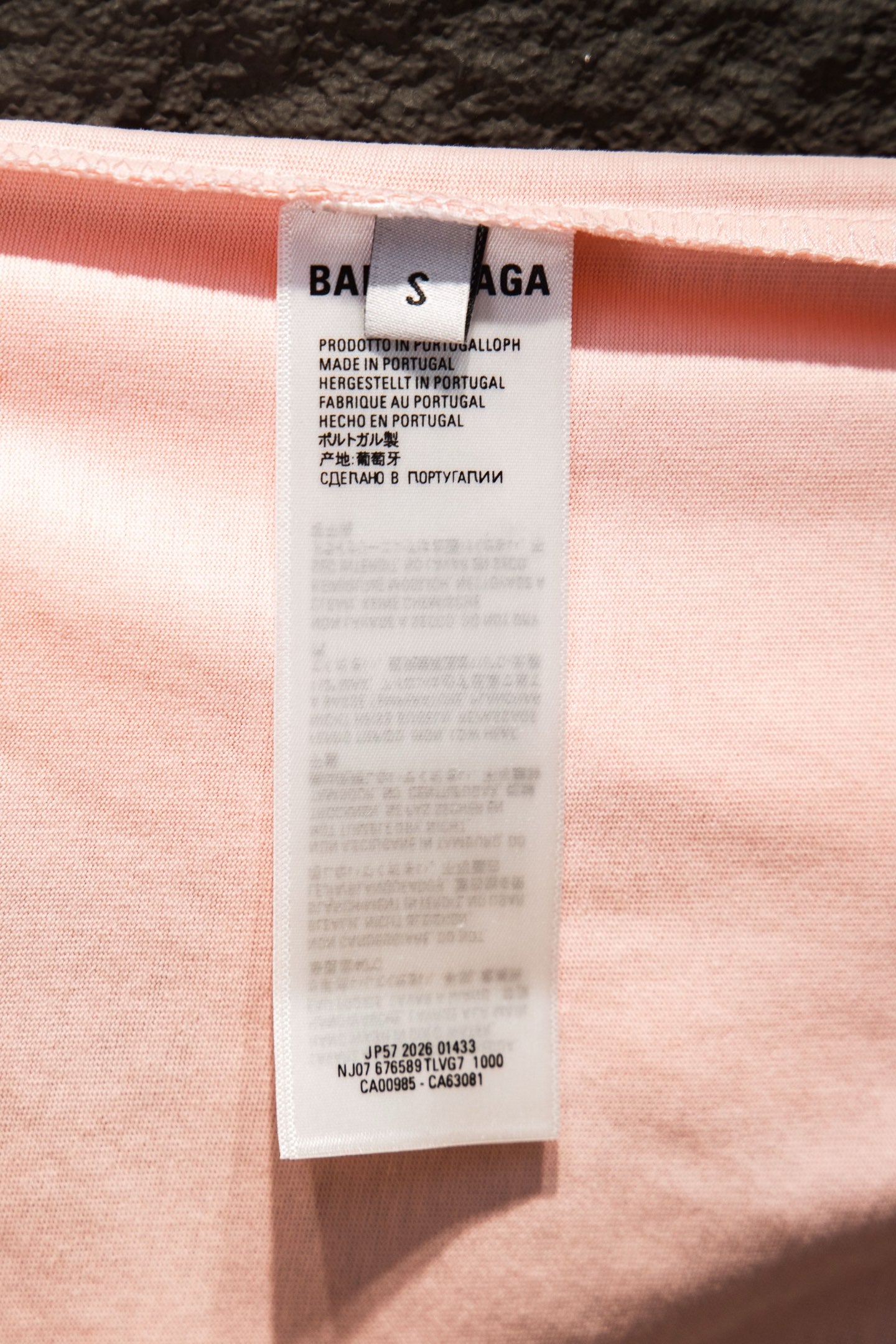 Pink T-shirt interior care label with printed Balenciaga branding