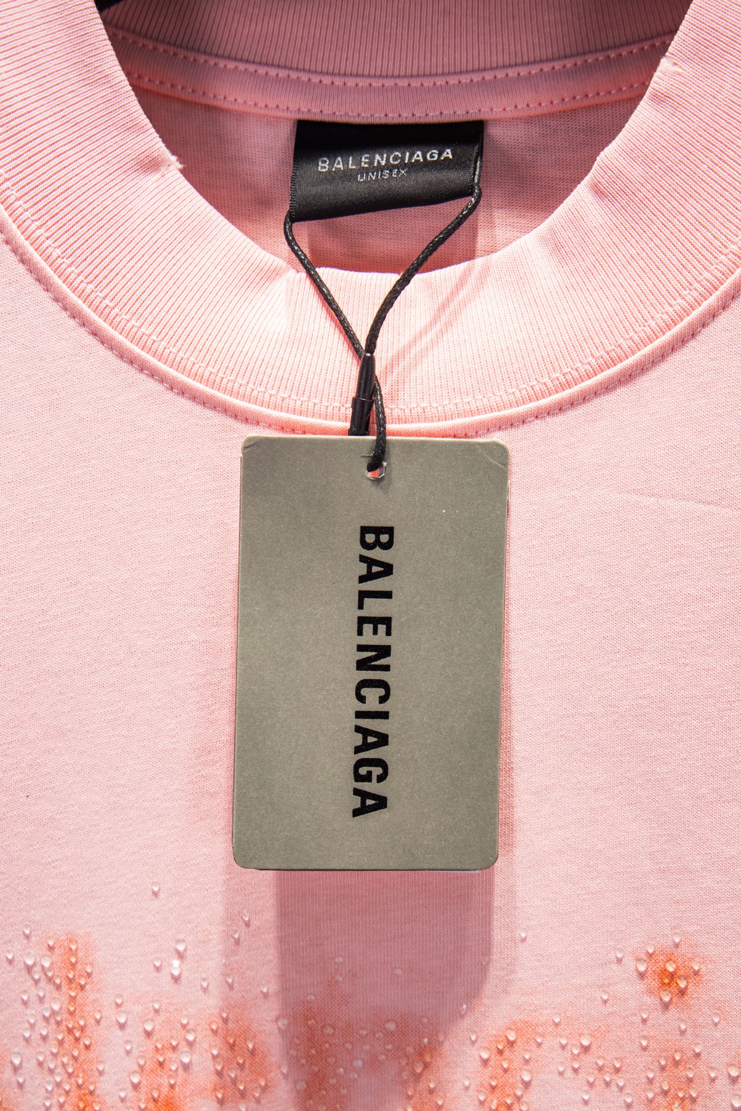 Pink crewneck T-shirt with Balenciaga size tag at neckline