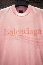 Pink crewneck T-shirt with glitter rhinestone Balenciaga logo across chest