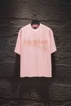 Pink short-sleeve crewneck T-shirt with Balenciaga rhinestone logo on chest