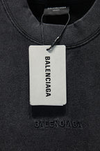Balenciaga T-shirt collar with hanging tag reading BALENCIAGA, dark gray