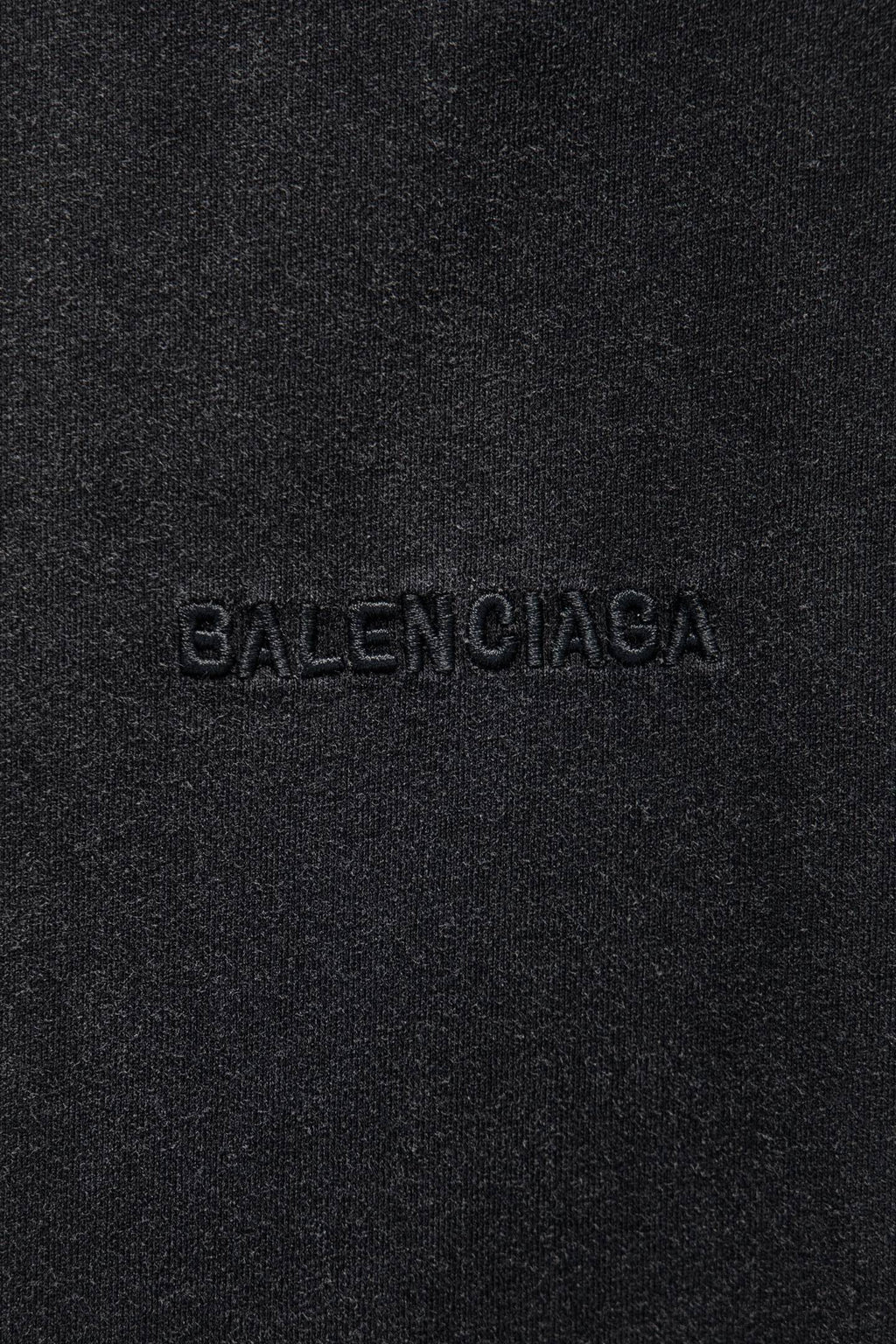 Balenciaga logo embroidery on dark gray fabric