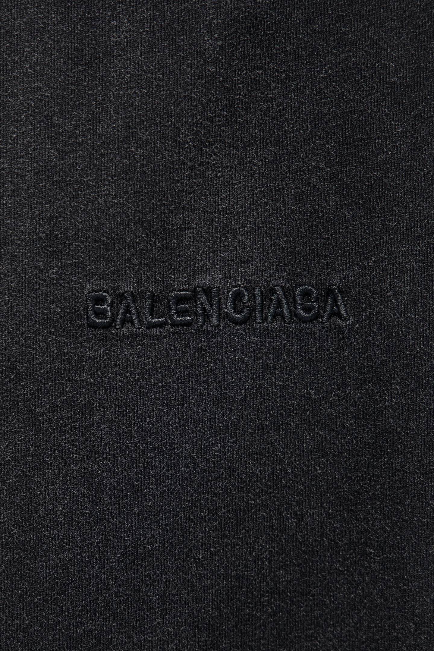 Balenciaga logo embroidery on dark gray fabric