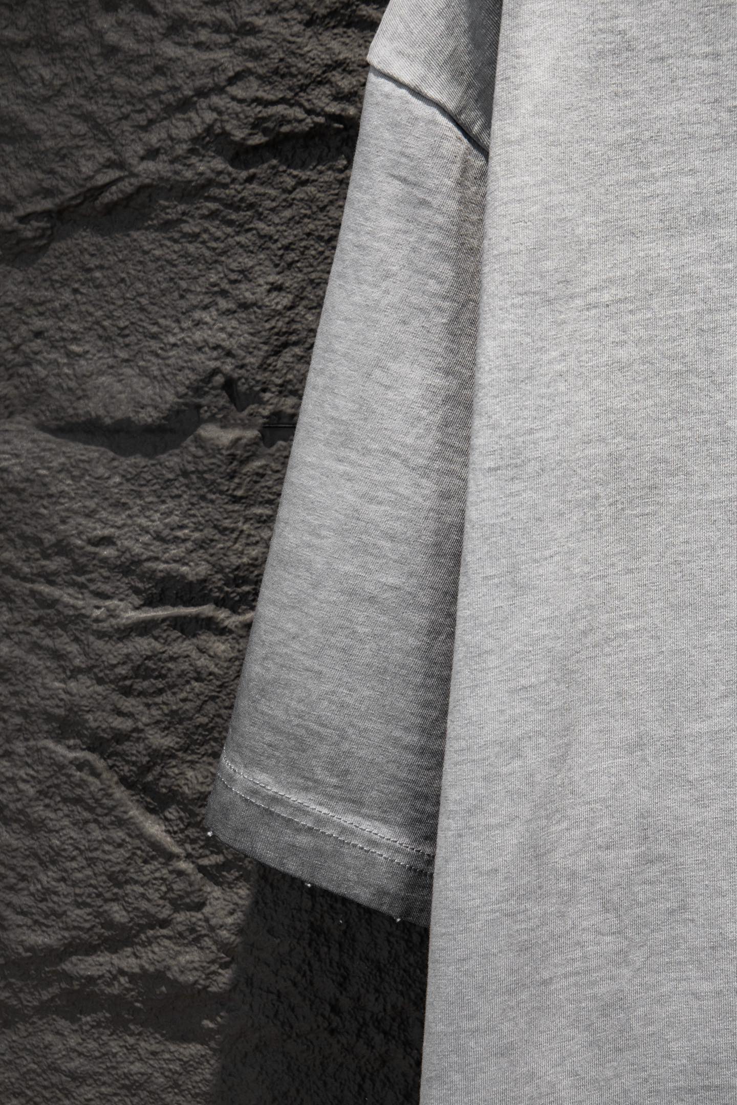 Balenciaga T-shirt hem and sleeve edge, light gray.