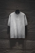 Balenciaga short-sleeve T-shirt, light gray with small chest logo.