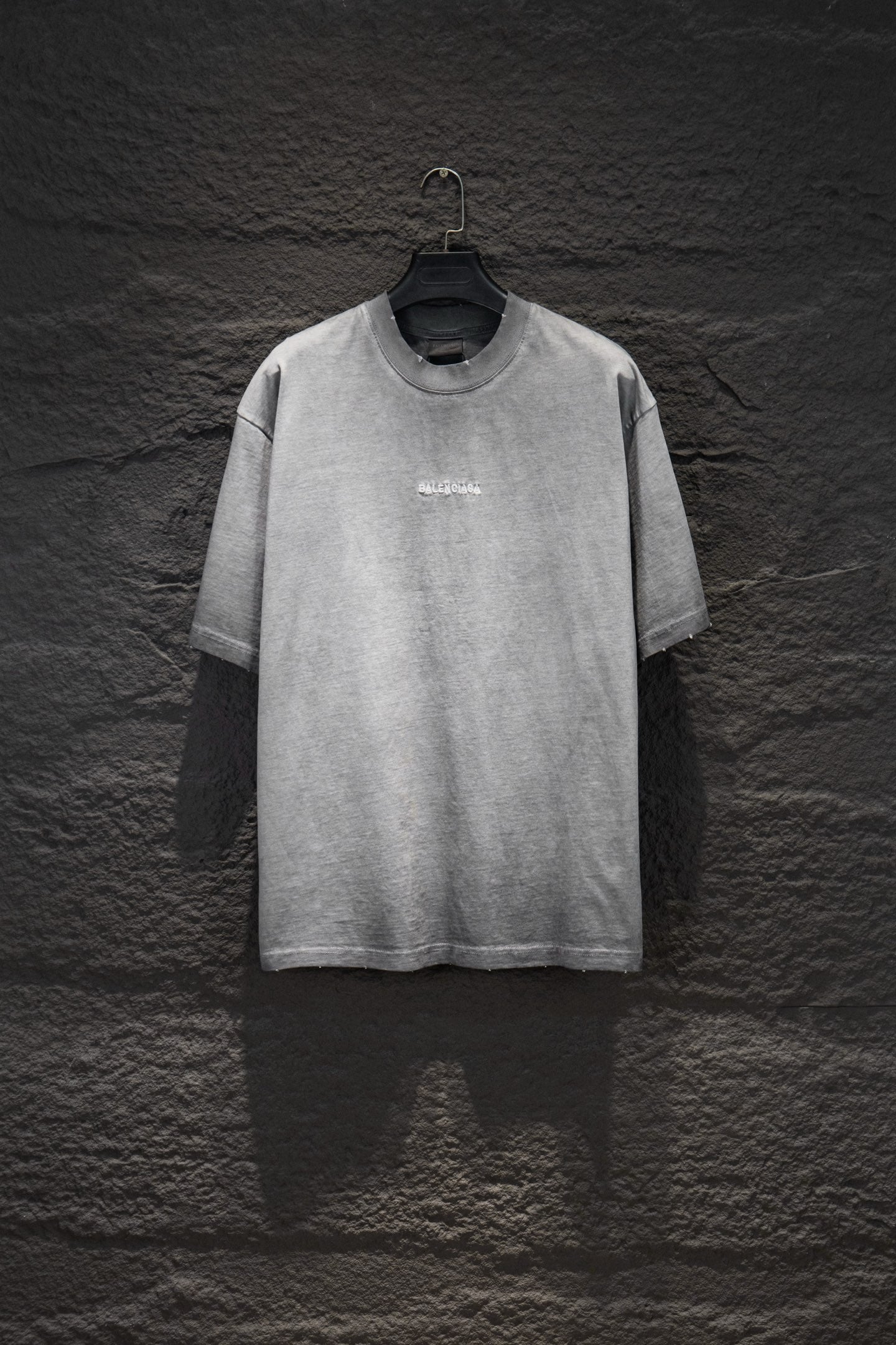 Balenciaga short-sleeve T-shirt, light gray with small chest logo.