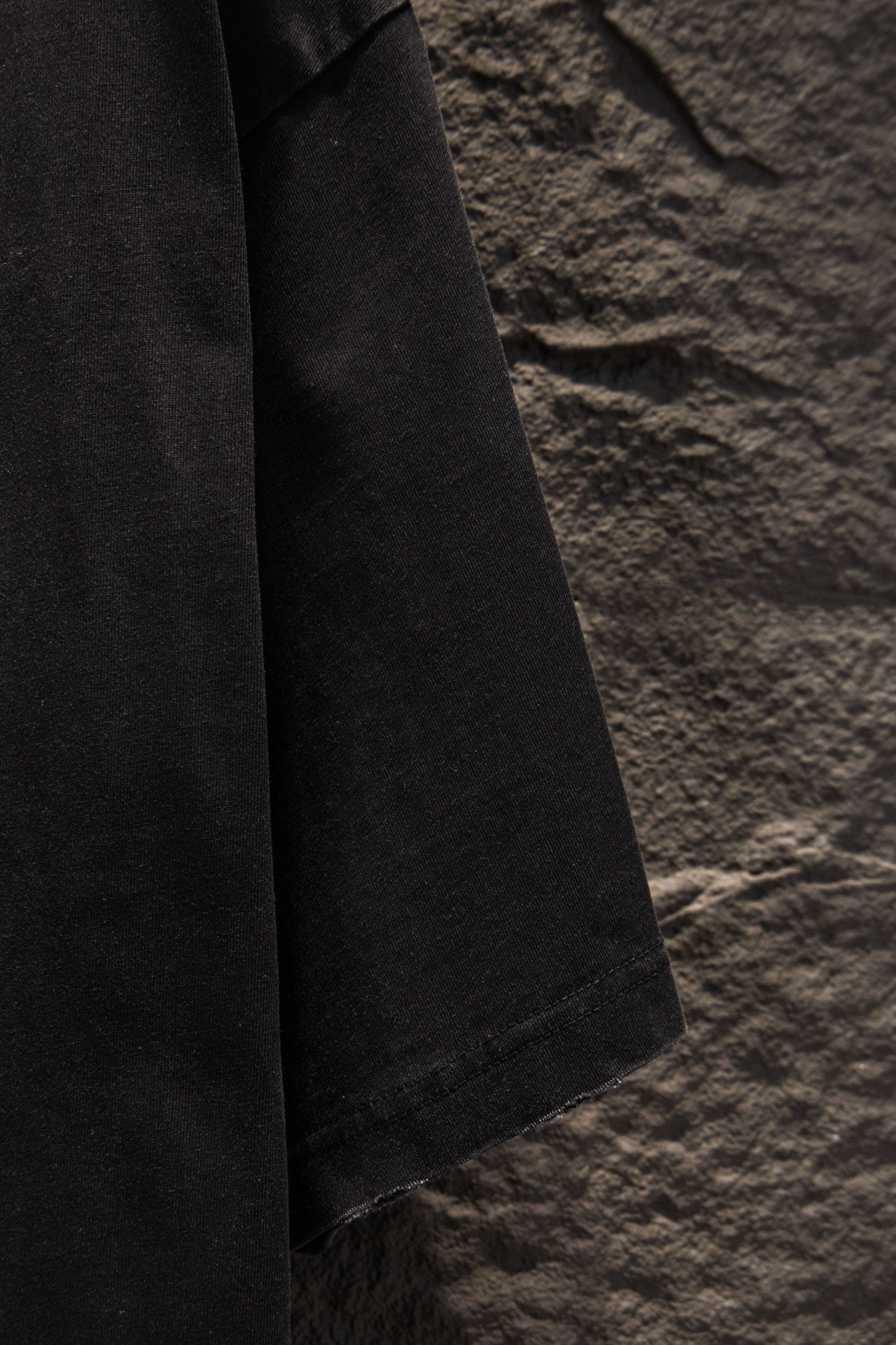 Balenciaga black short-sleeve T-shirt side view with stitched hem