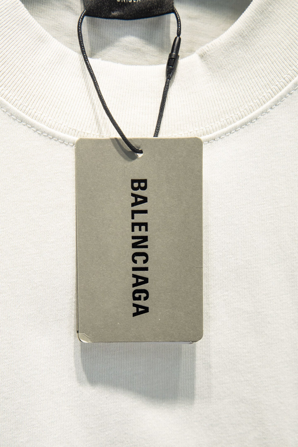 Balenciaga white crewneck T-shirt with hanging brand tag at neckline