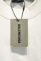 Balenciaga white crewneck T-shirt with hanging brand tag at neckline
