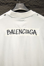 Balenciaga white T-shirt with large black BALENCIAGA logo across chest