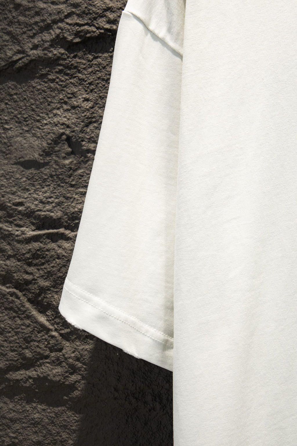 Balenciaga white short-sleeve T-shirt side view with curved hem