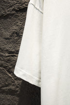 Balenciaga white short-sleeve T-shirt side view with curved hem