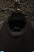 Balenciaga black T-shirt close-up of crew neck and inner label