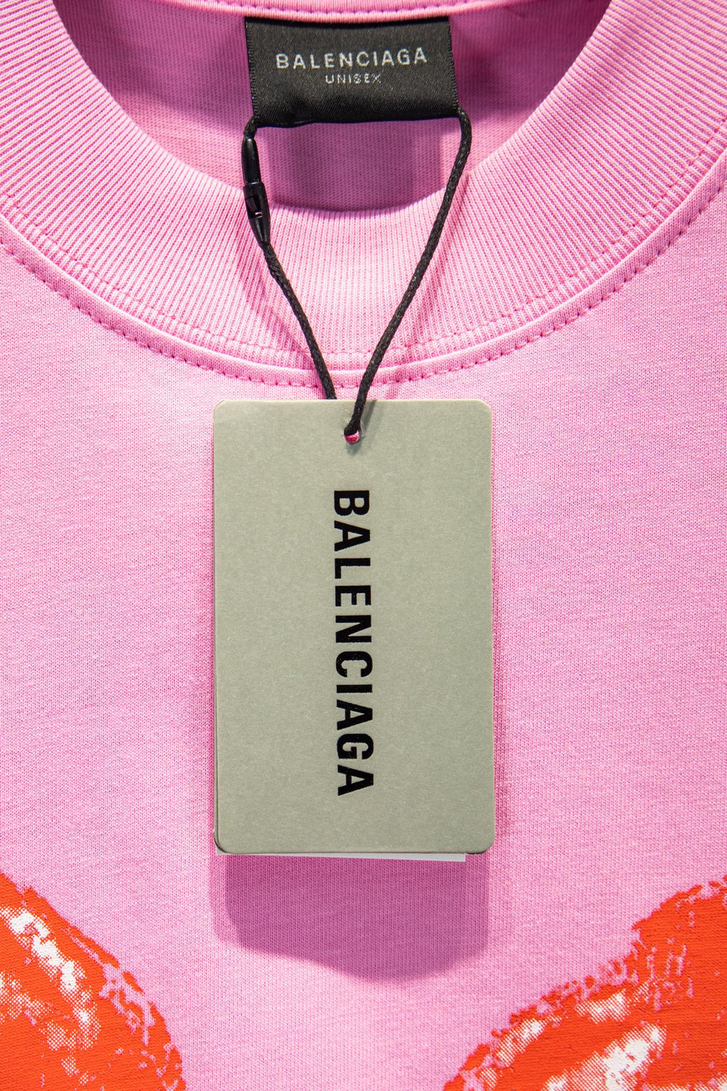Balenciaga pink T-shirt with hang tag showing BALENCIAGA