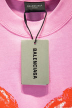 Balenciaga pink T-shirt with hang tag showing BALENCIAGA
