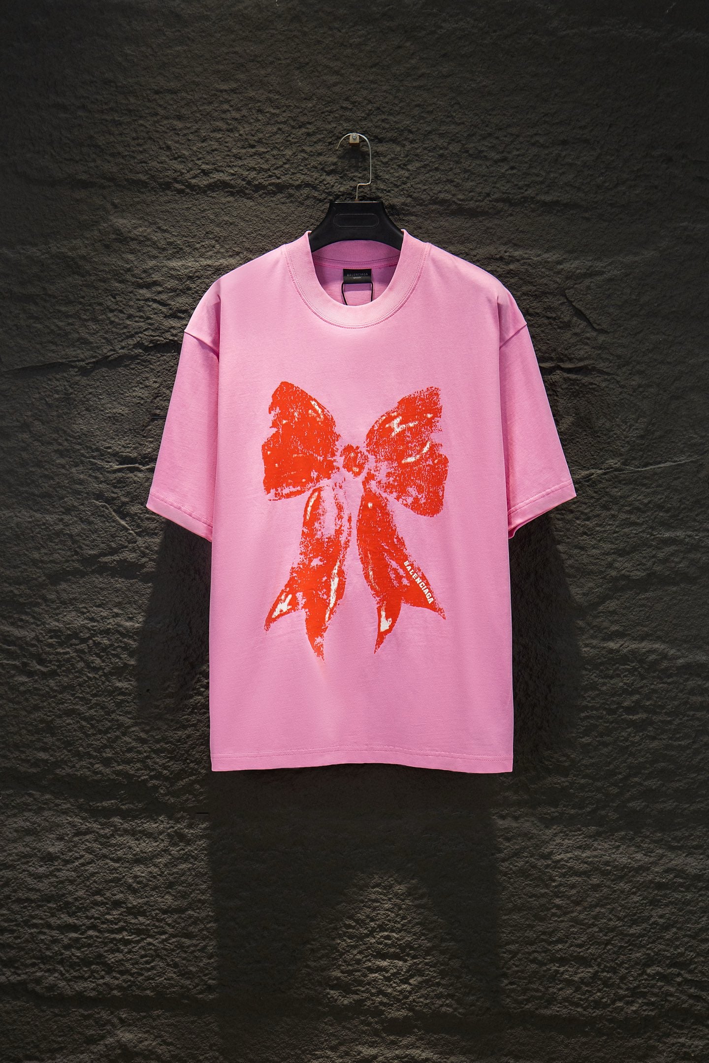 Balenciaga pink T-shirt with orange bow graphic front