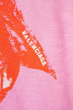 Balenciaga pink T-shirt detail: orange bow graphic with BALENCIAGA