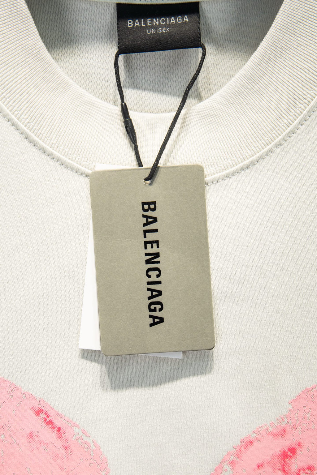 White T-shirt neckline with inner neck label and rectangular “BALENCIAGA” hang tag