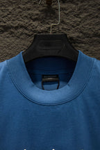 Blue crewneck T-shirt close-up of collar and Balenciaga neck label