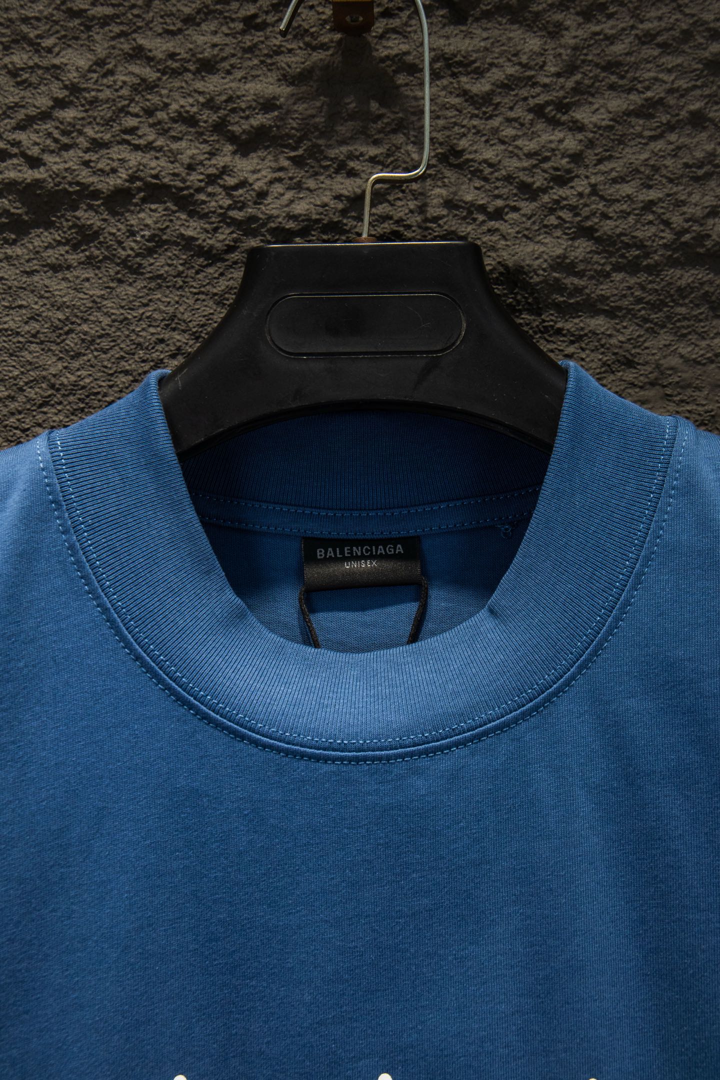 Blue crewneck T-shirt close-up of collar and Balenciaga neck label