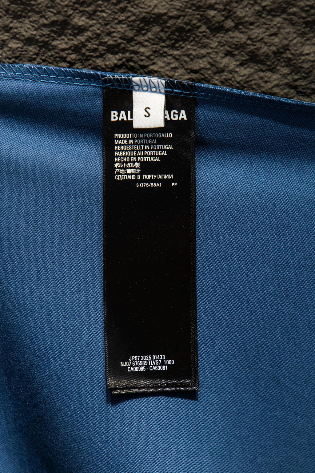 Blue T-shirt inner label tag with Balenciaga care and size details
