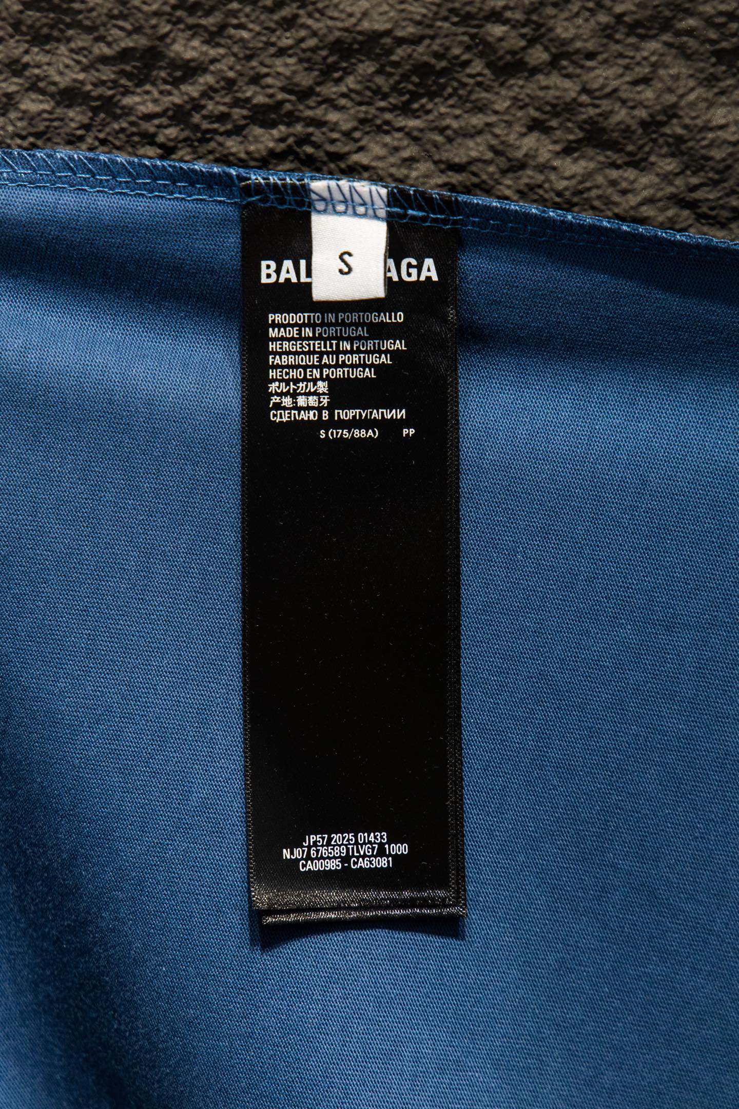 Blue T-shirt inner label tag with Balenciaga care and size details