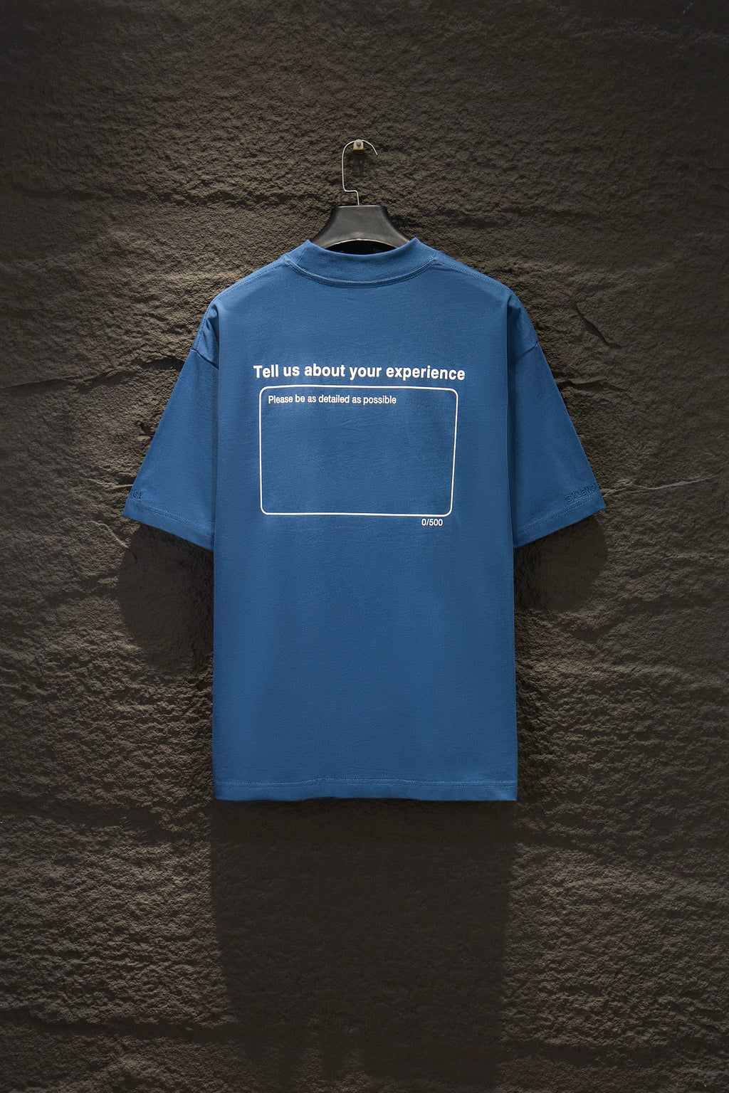 Blue short-sleeve T-shirt with back graphic text inside a rectangle