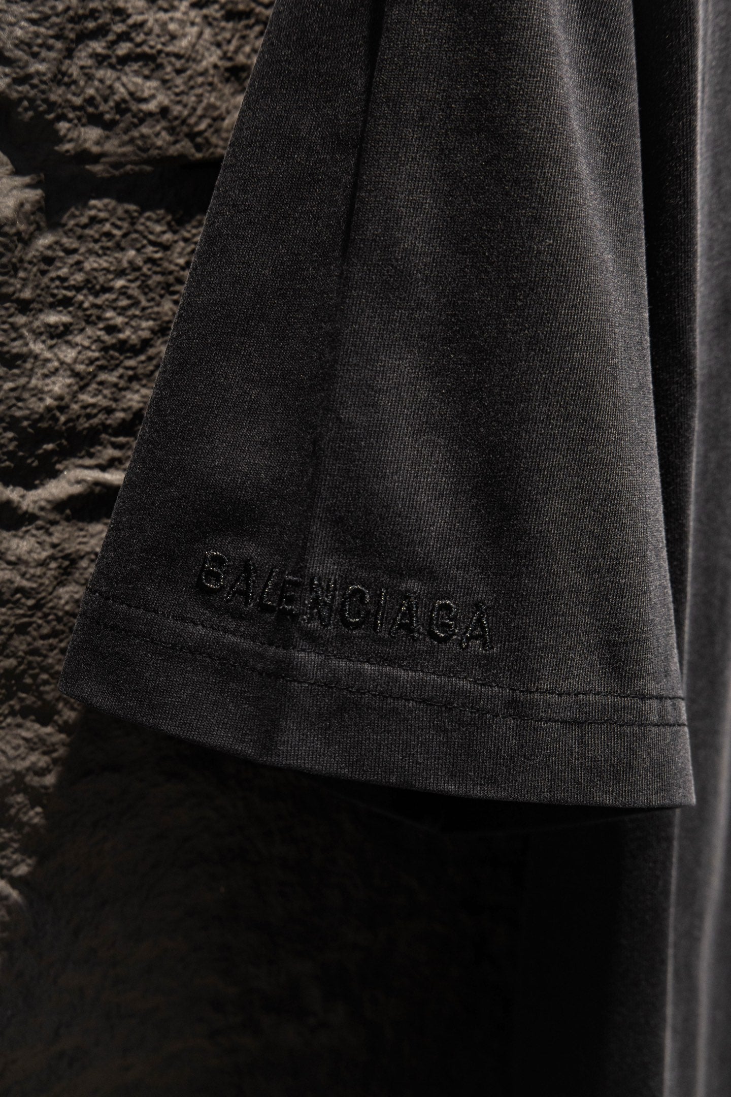 Black T-shirt with embroidered “BALENCIAGA” on the lower sleeve