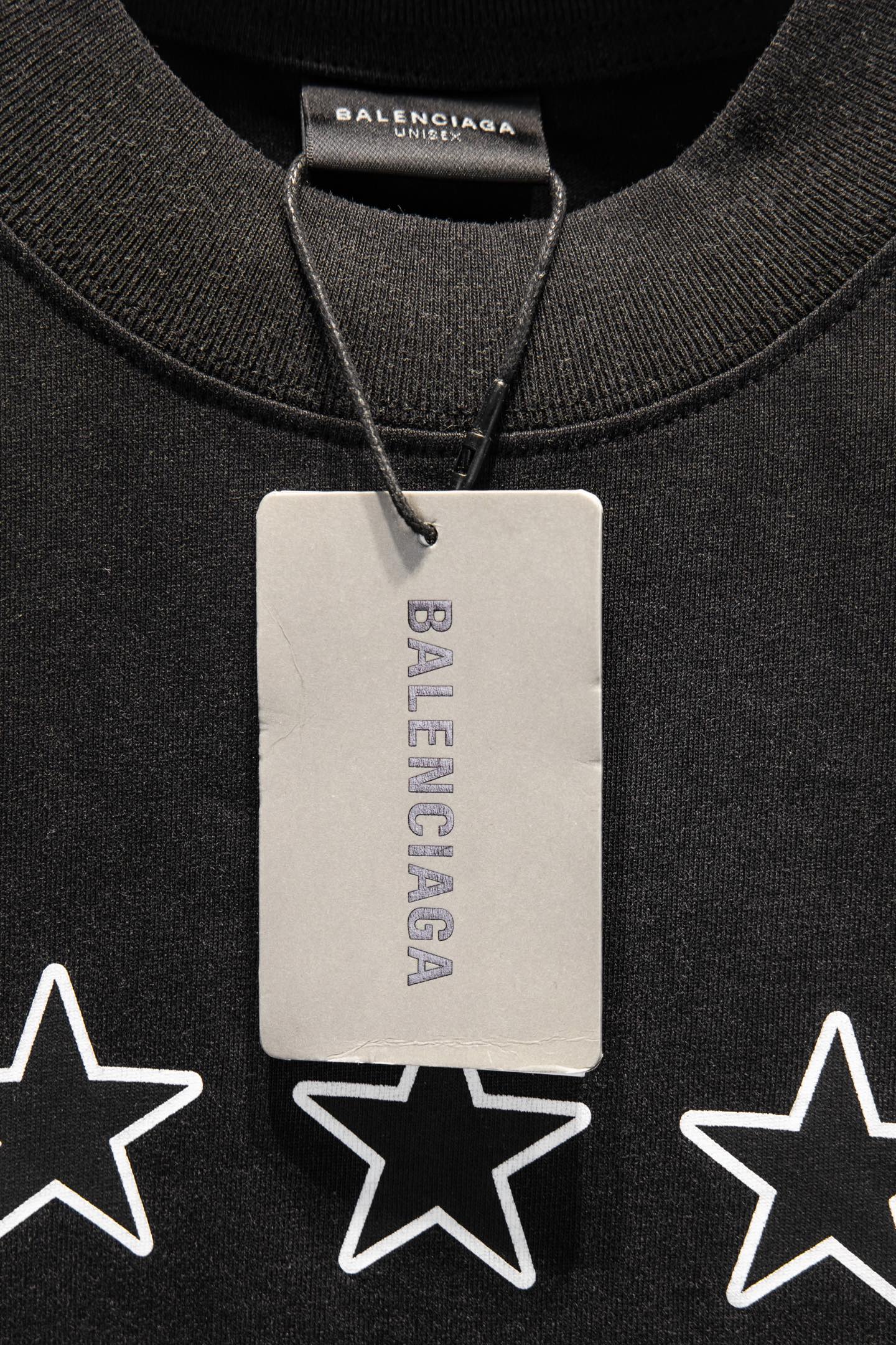 Black T-shirt collar with hang tag and white star print below
