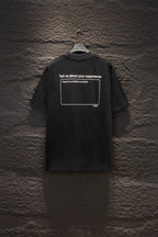 Black short-sleeve T-shirt with a centered rectangular customer-text graphic