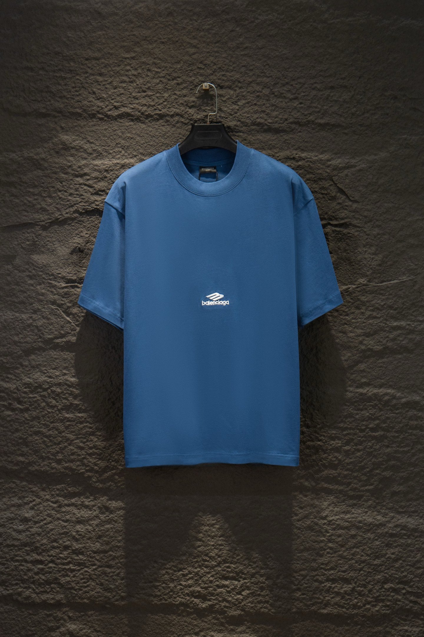 Blue short-sleeve T-shirt with small white chest logo print