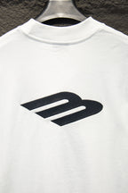 White T-shirt with oversized black Balenciaga logo print.