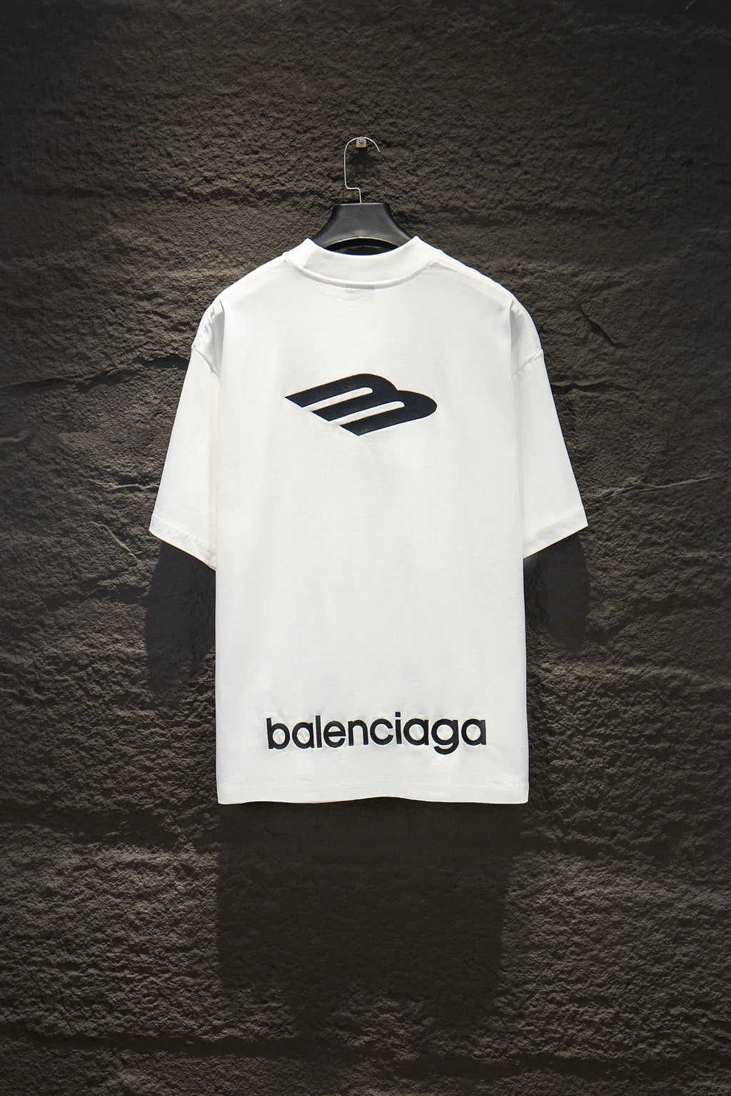 White Balenciaga short-sleeve T-shirt with large logo graphic and balenciaga text.