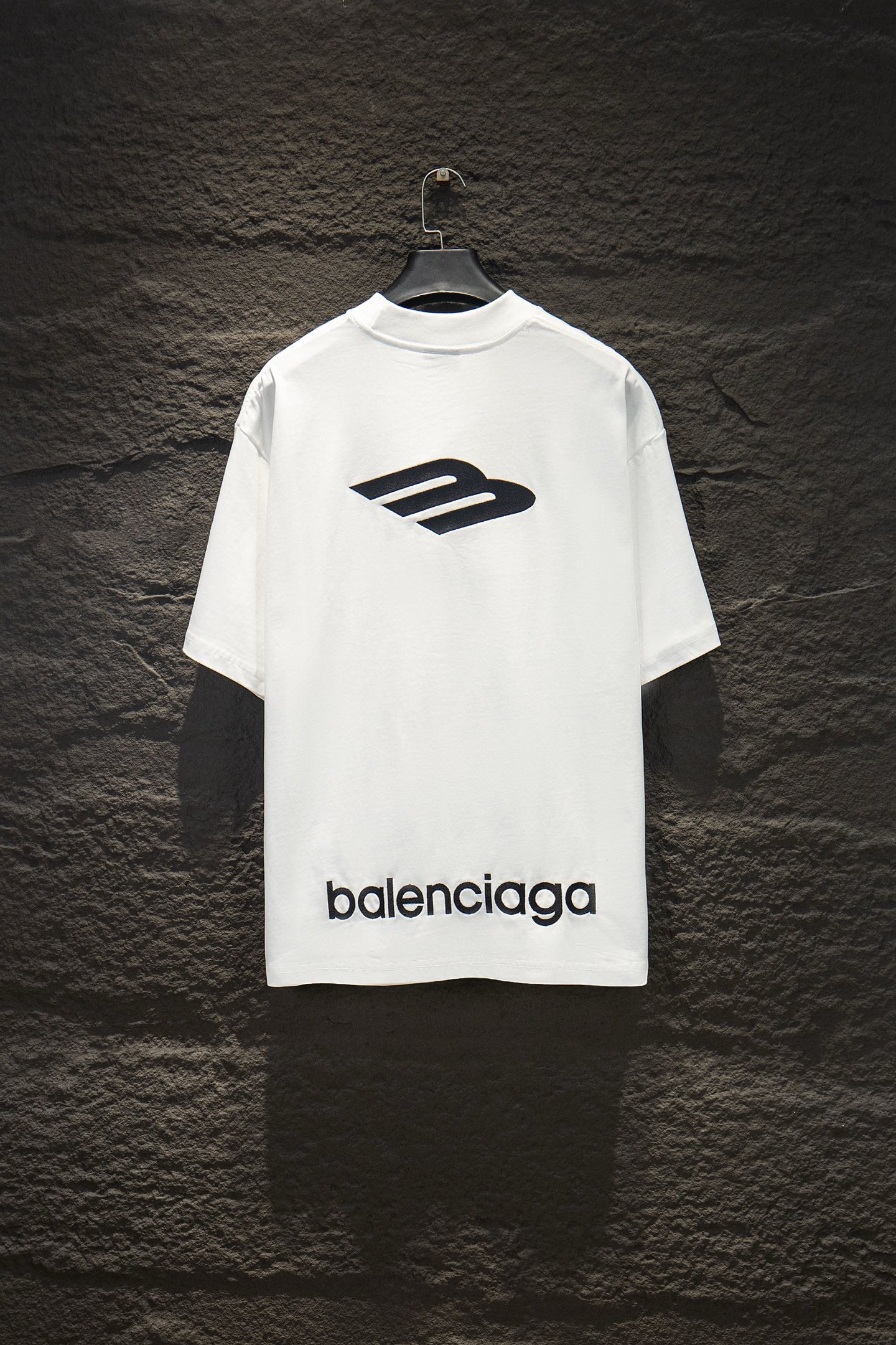 White Balenciaga short-sleeve T-shirt with large logo graphic and balenciaga text.