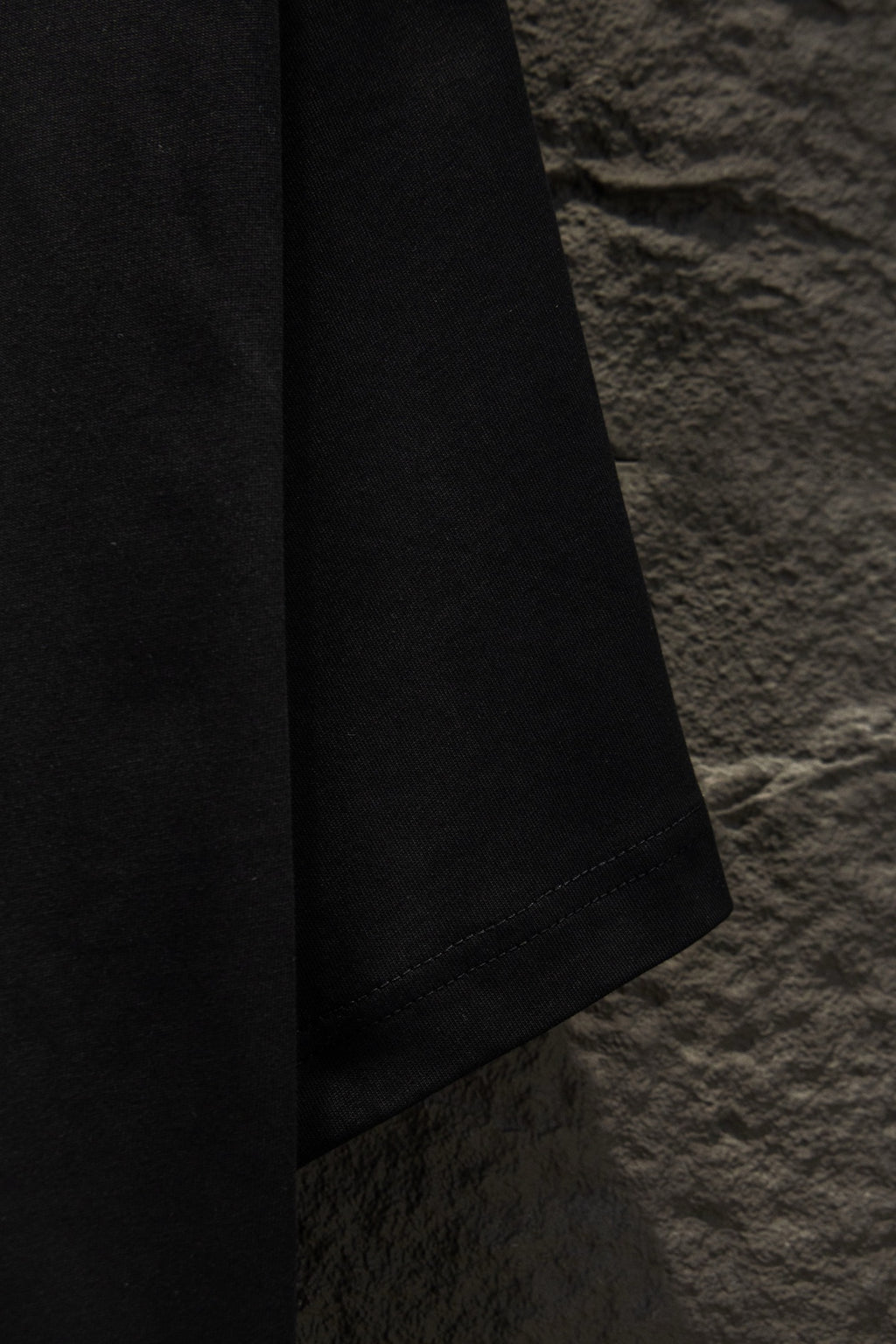 Balenciaga black short-sleeve T-shirt, side view of hem and sleeve
