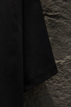 Balenciaga black short-sleeve T-shirt, side view of hem and sleeve